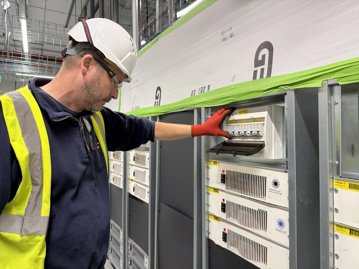 commissioning engineer inspecting heatload server emulator